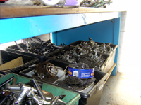 bike parts waiting to be sorted for recycling - click to enlarge